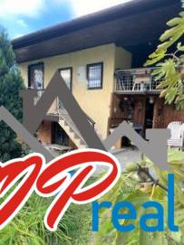 A two-story cottage in Košice, Vyšné Opátske district, in a natural setting.