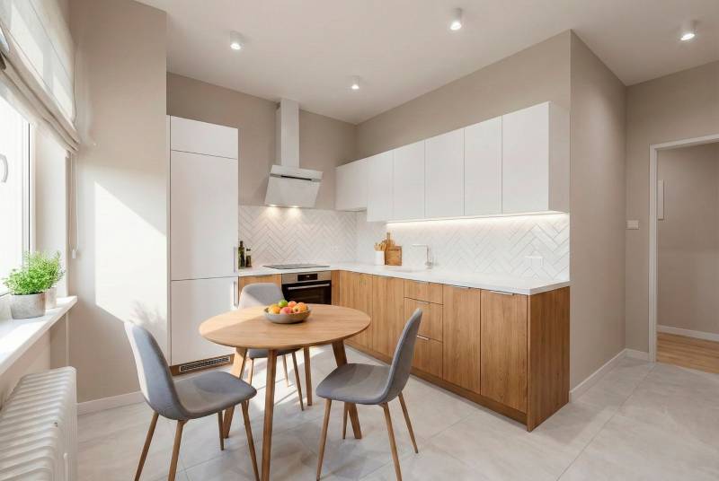 A kitchen in a 2-room apartment with a wood-patterned floor and modern appliances.