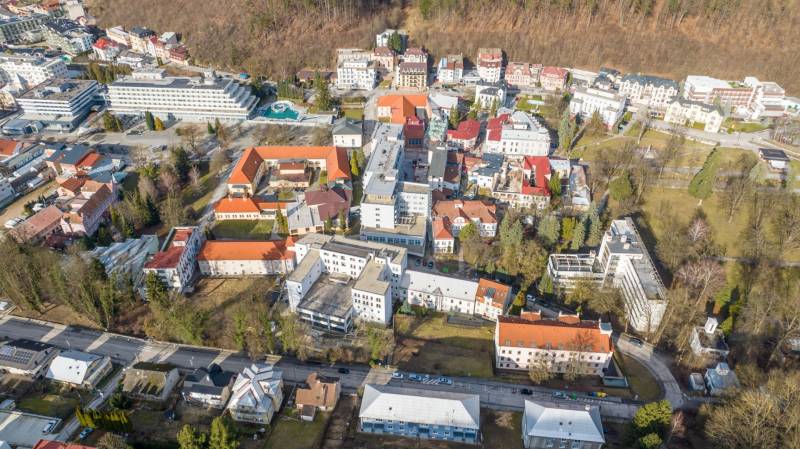 Aerial view of Trenčianske Teplice, Hurbanova Street with commercial plots and surroundings.