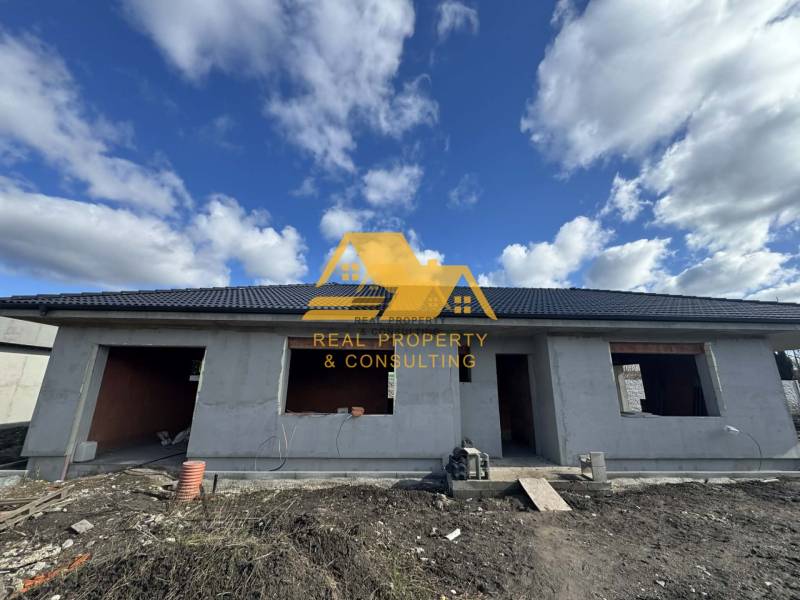 A family house under construction on a street in Nové Zámky. Without finished windows and doors.