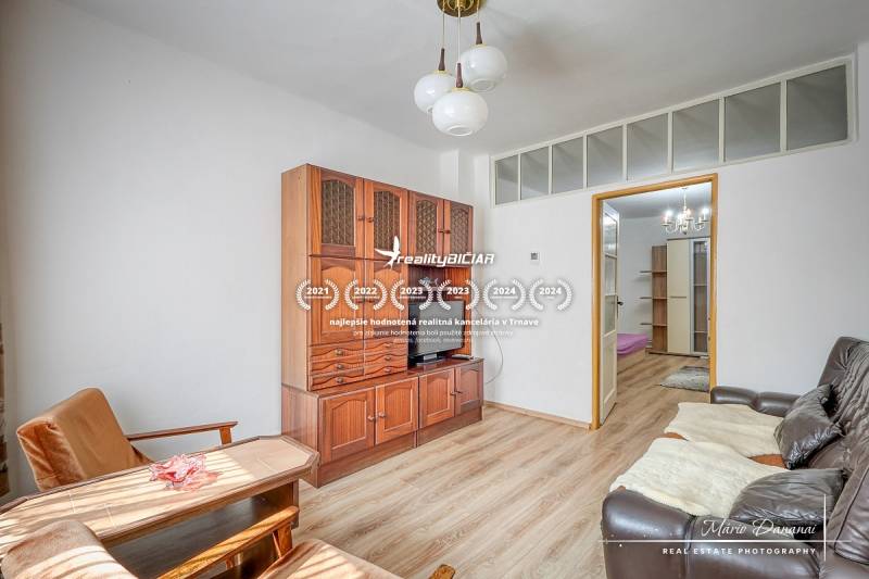 Living room in a family house with wooden furniture and comfortable seating.
