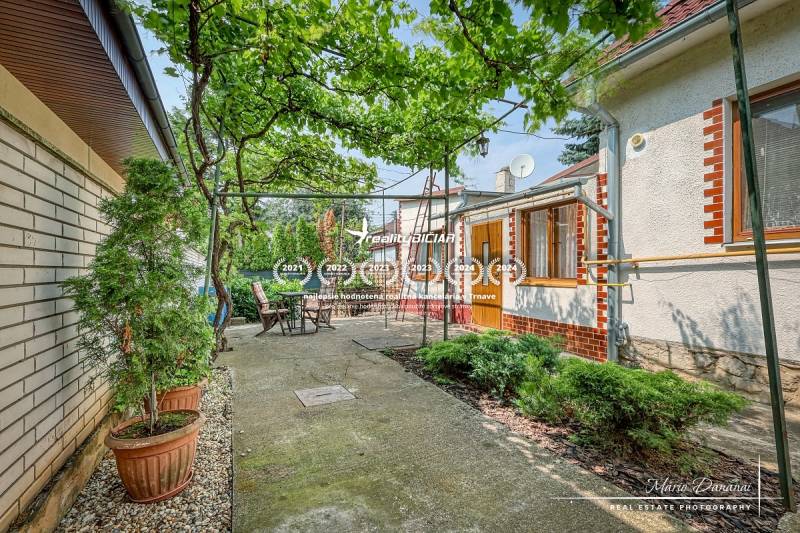 A family house on a quiet street in Trnava with a terrace and greenery.