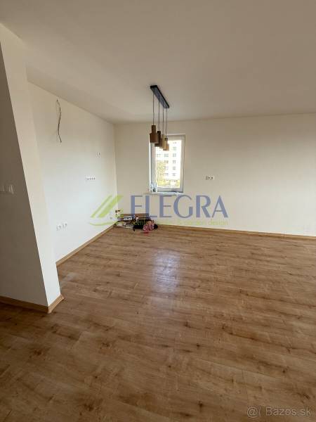 A two-room apartment with a wooden decor floor and pendant lights.