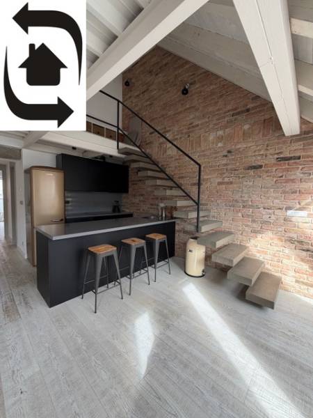 Kitchen corner with a bar and staircase in a 4-room apartment, floor with wood decor.