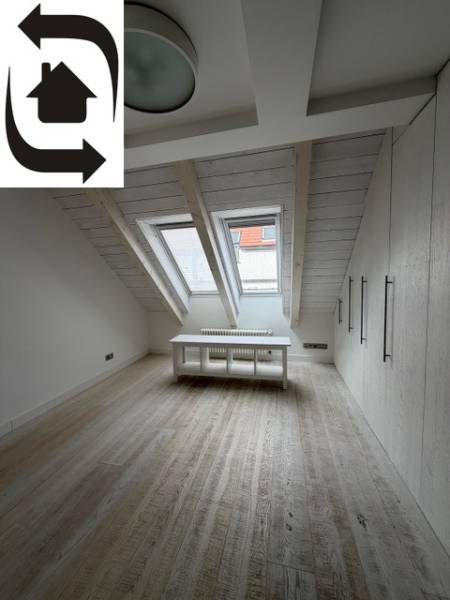Skylights and wood-patterned flooring in a 4-room apartment.
