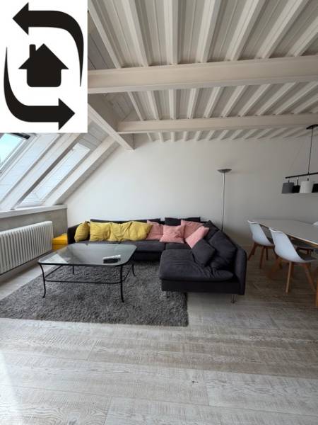 Living room with wood-patterned flooring, a sofa, and a dining table in a 4-room apartment.