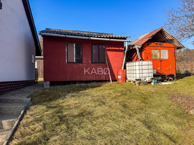 Red buildings near the vineyards on Ambrova Street in Nitra with a plastic water tank.