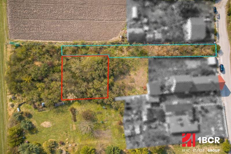 Aerial view of residential plots in the area of Malá Paka, Veľká Paka with surrounding greenery.