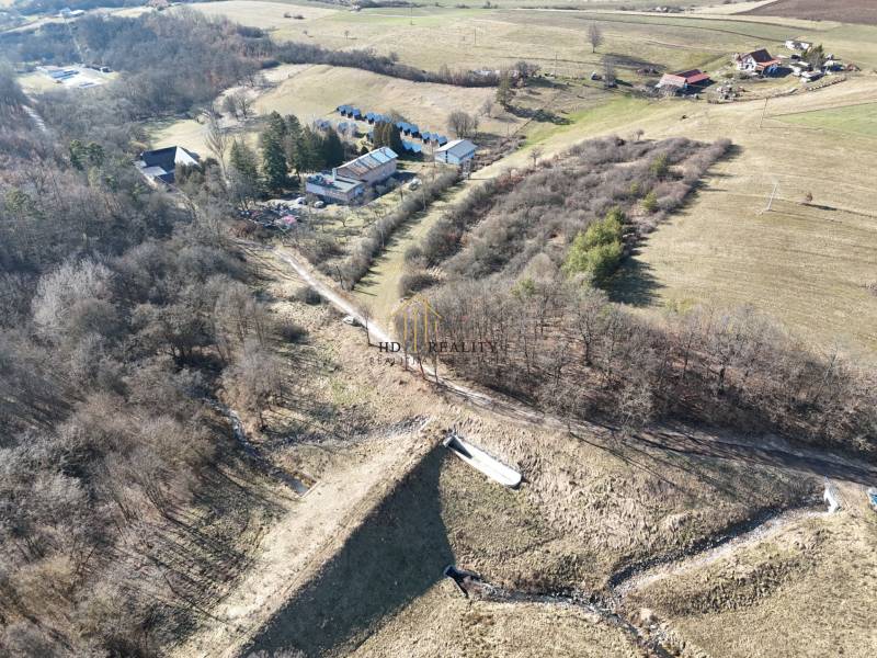 Aerial view of residential plots around Krupina with natural scenery.