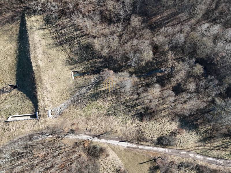 Aerial view of meadows and forests around Krupina suitable for plots - housing.