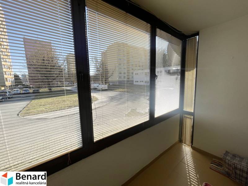 Glazed balcony in a 3-room apartment on Matice Slovenskej Street, Prešov, with a view of the parking lot.