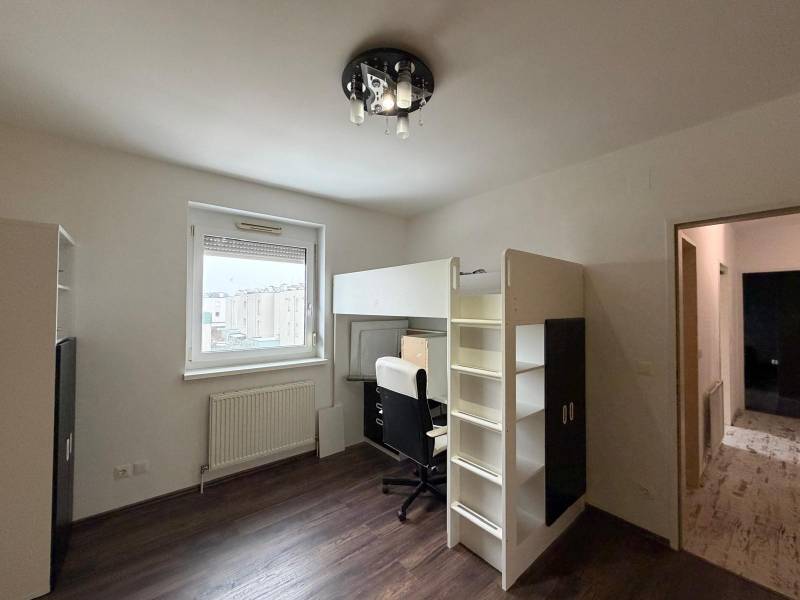 Children's room in a 3-room apartment with a bunk bed and a floor with a wooden decor.