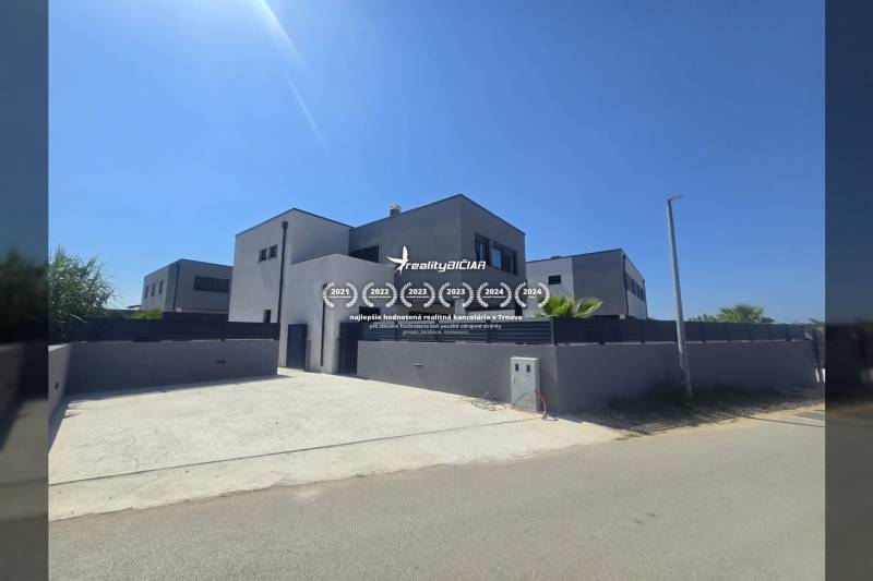 Villa on Zukve Street in Vrsi with a large driveway and a simple facade.