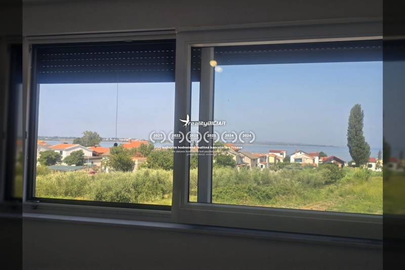 The view from the Villa on Zukve in Vrsi offers a sight of rooftops and the coastline.