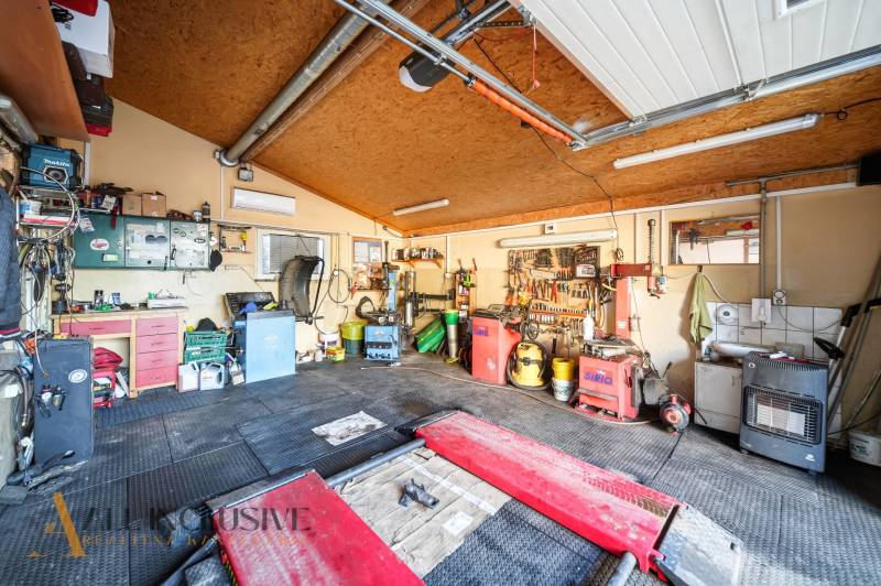 A garage in a family house with tools, equipment, and high-quality gear for work activities.