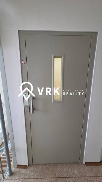 Light gray elevator doors in an apartment building on Humenská Street in Košice, West district.