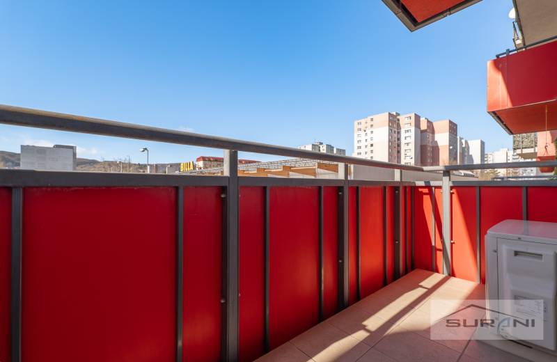 The balcony of a 3-room apartment on Saratovská Street in Bratislava - Dúbravka with a view of the city.