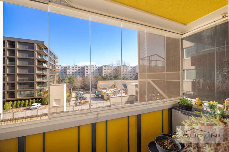 Enclosed loggia with a view of modern apartment buildings, 3-room apartment, Dúbravka, Bratislava.