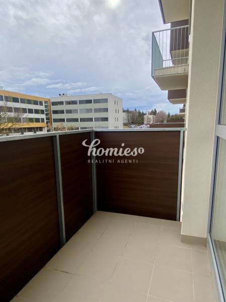 A balcony in a 2-room apartment with a view of the buildings on Pivovarská Street in Nitra.