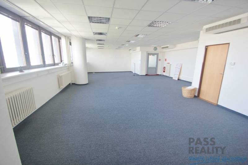 Spacious offices with blue carpet and windows on Kutlíkova Street in Bratislava-Lúky.