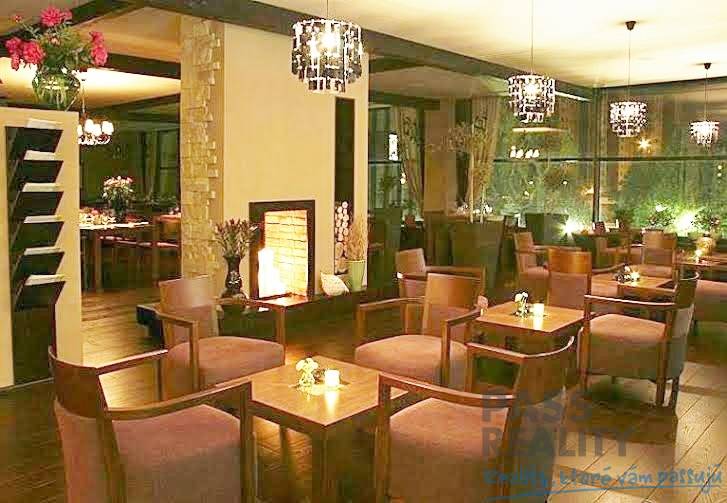 Stylish offices with wood-patterned flooring, comfortable seating, and ambient lighting.