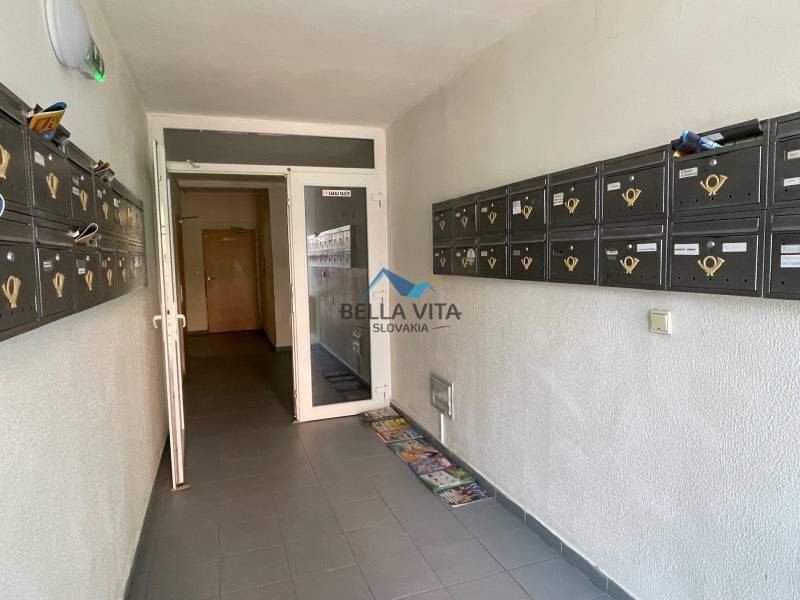 Entrance hallway with mailboxes in an apartment building on Vodárenská Street in Galanta.
