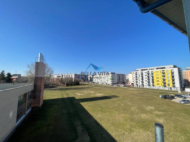 View of the housing estate from Vodárenská Street in Galanta with one-bedroom apartments and greenery.