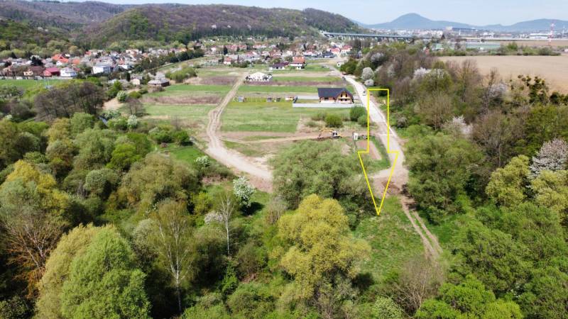 Aerial view of land in Haniska surrounded by greenery and road infrastructure.