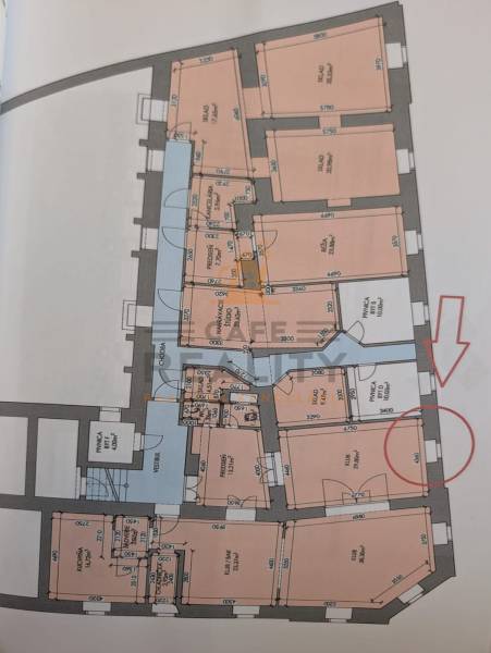 Architectural plan of commercial spaces with room labels and dimensions.