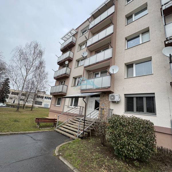 Apartment building on Thuroczyho Street in Šahy with multiple balconies and an entrance path.