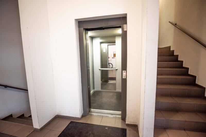 Staircase and open elevator in an apartment building on Hrachova Street in Bratislava, Ružinov.