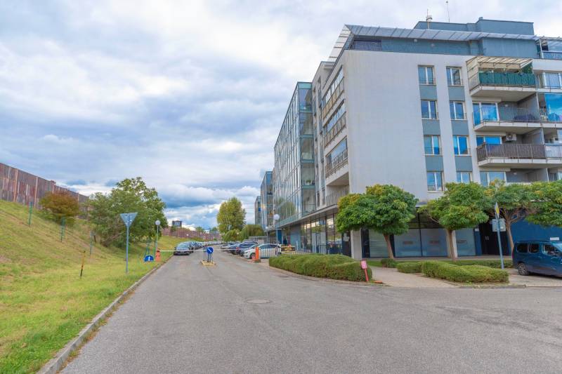 Hrachová Street in Bratislava - Ružinov with modern architecture and parking in front of the building.