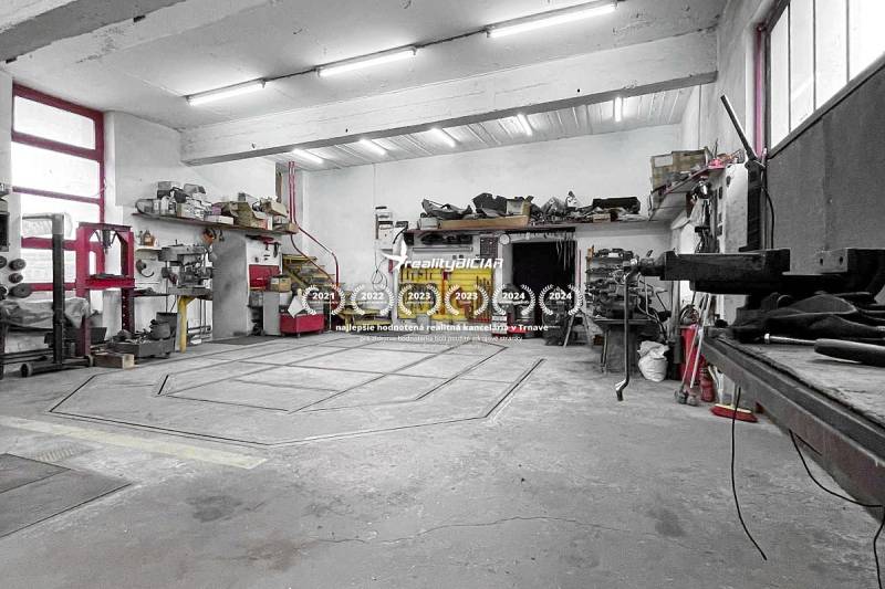Workshop with tools and stairs in a family house. Ceilings with lighting and concrete floor.