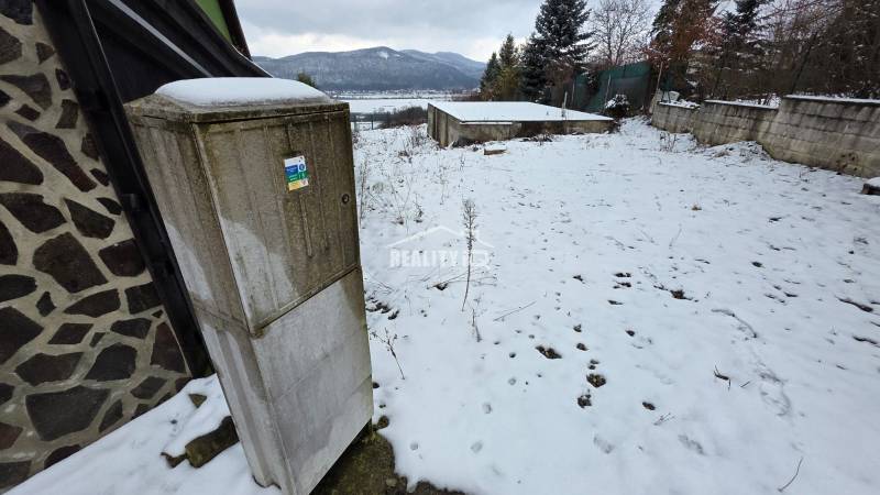 Snowy exterior at the Recreation Grounds in Považská Bystrica with a view of the snow-covered hills.