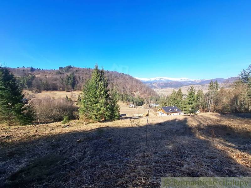 Agricultural and forest land in Hronec with picturesque views of the surrounding hills.