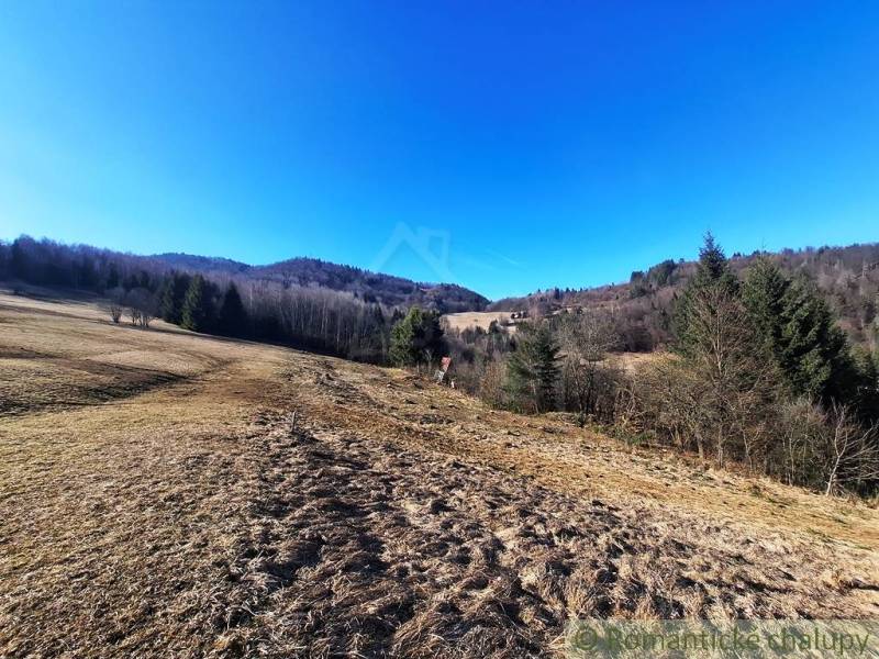 Scenery of agricultural and forest lands in Hronec with vast meadows and forests.
