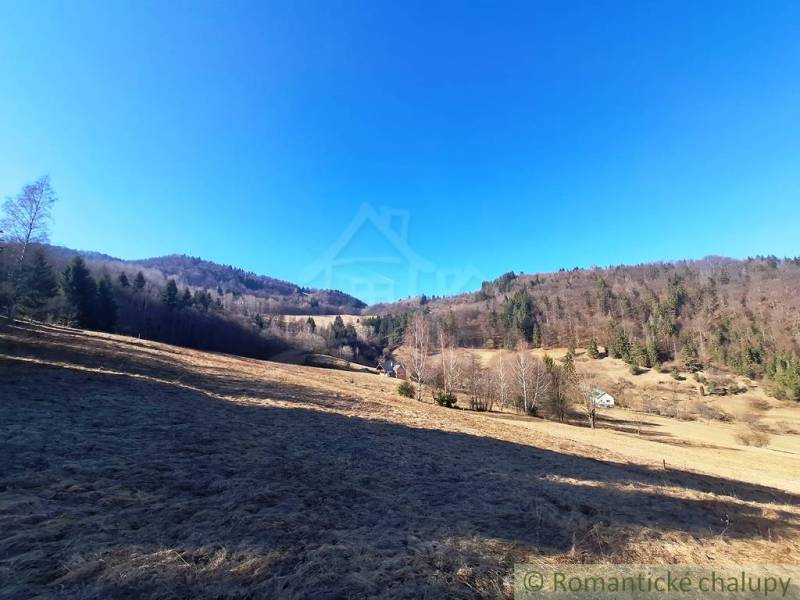 Extensive agricultural and forest lands around Hronec surrounded by forests and hills.