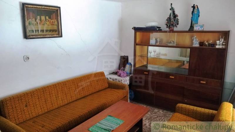 Living room in a family house with retro furniture and historical decorations.