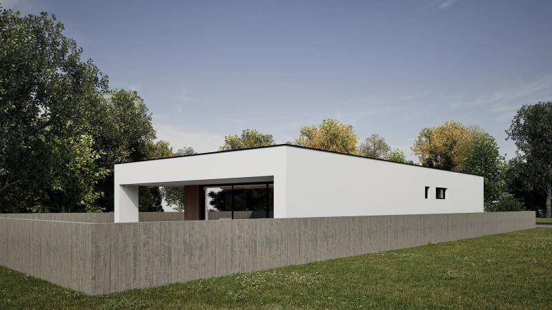 A modern family house in Nesvady with a simply designed white facade and green surroundings.