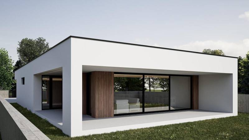 A family house in Nesvady with large windows and wooden cladding in the garden.