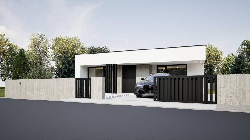 A family house in Nesvady with a white facade, a black fence, and a parked car.