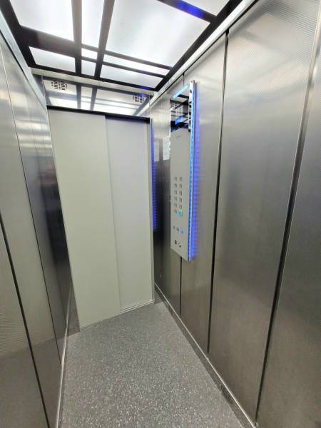 Metal interior and wooden decor flooring in a 2-room apartment.