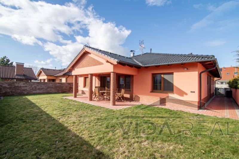 Family house on Krajná Street in Stupava, brick facade, spacious yard, terrace.