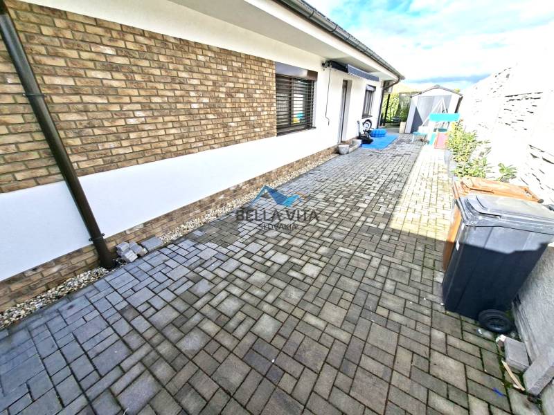 A family house on Mládežnícka Street in Galanta with interlocking paving throughout.