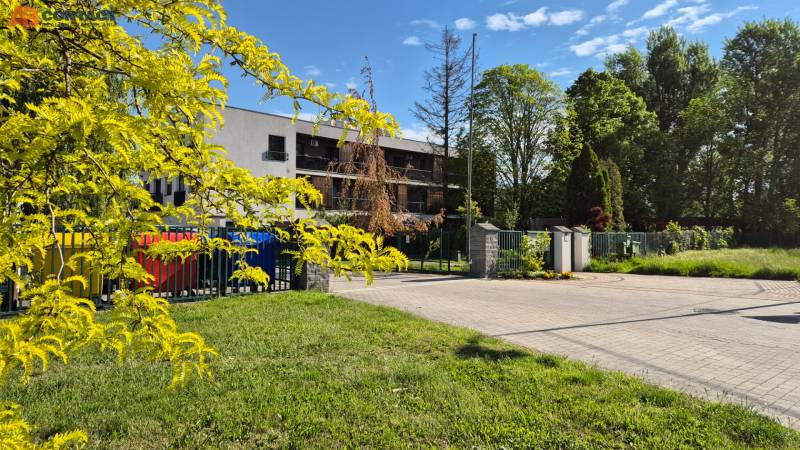 Building on Bodona Street with colorful containers, Studio apartment in a pleasant, green environment.