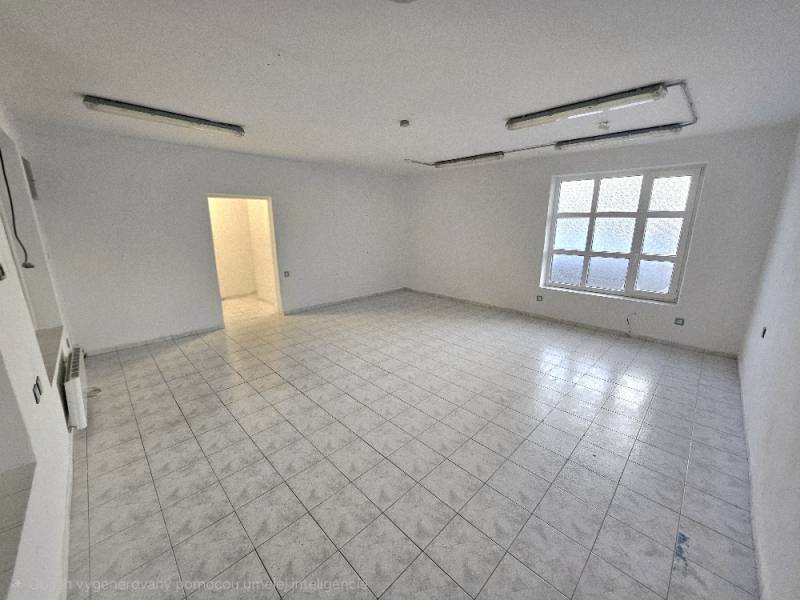 Empty commercial spaces with tiles and a window.