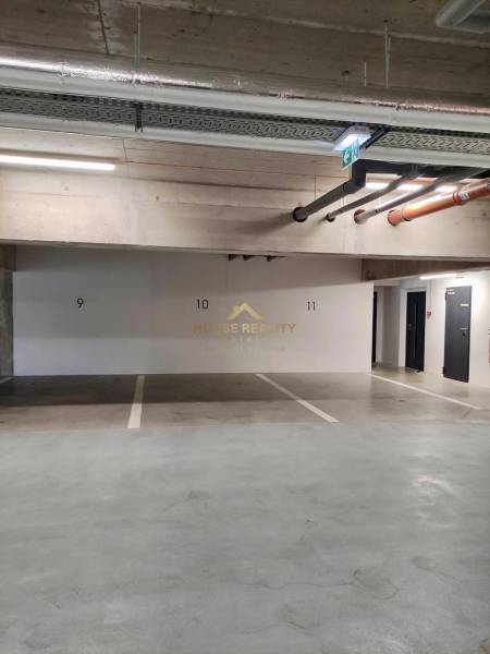 Parking garage with numbered spaces on Bernolákovská Street in Senec.