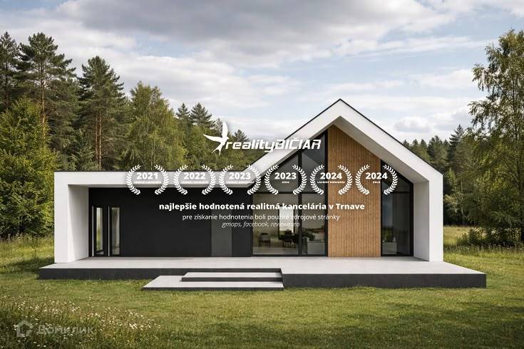 The family house on the property in Pavlice is surrounded by greenery and forest.