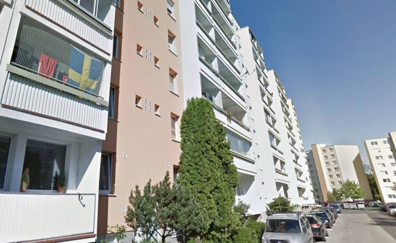Apartment buildings and cars on Bieloruská Street in Bratislava - Podunajské Biskupice.