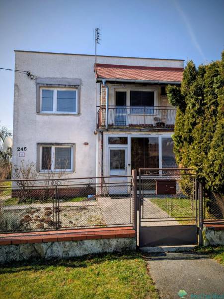 A family house on Nová Street in Lastovce with a small front garden and a balcony.